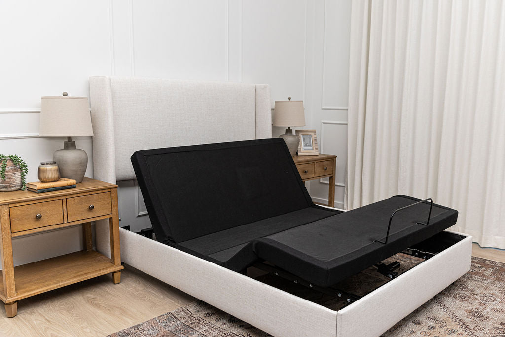 An adjustable base with no mattress and the head and foot of the bed raised.