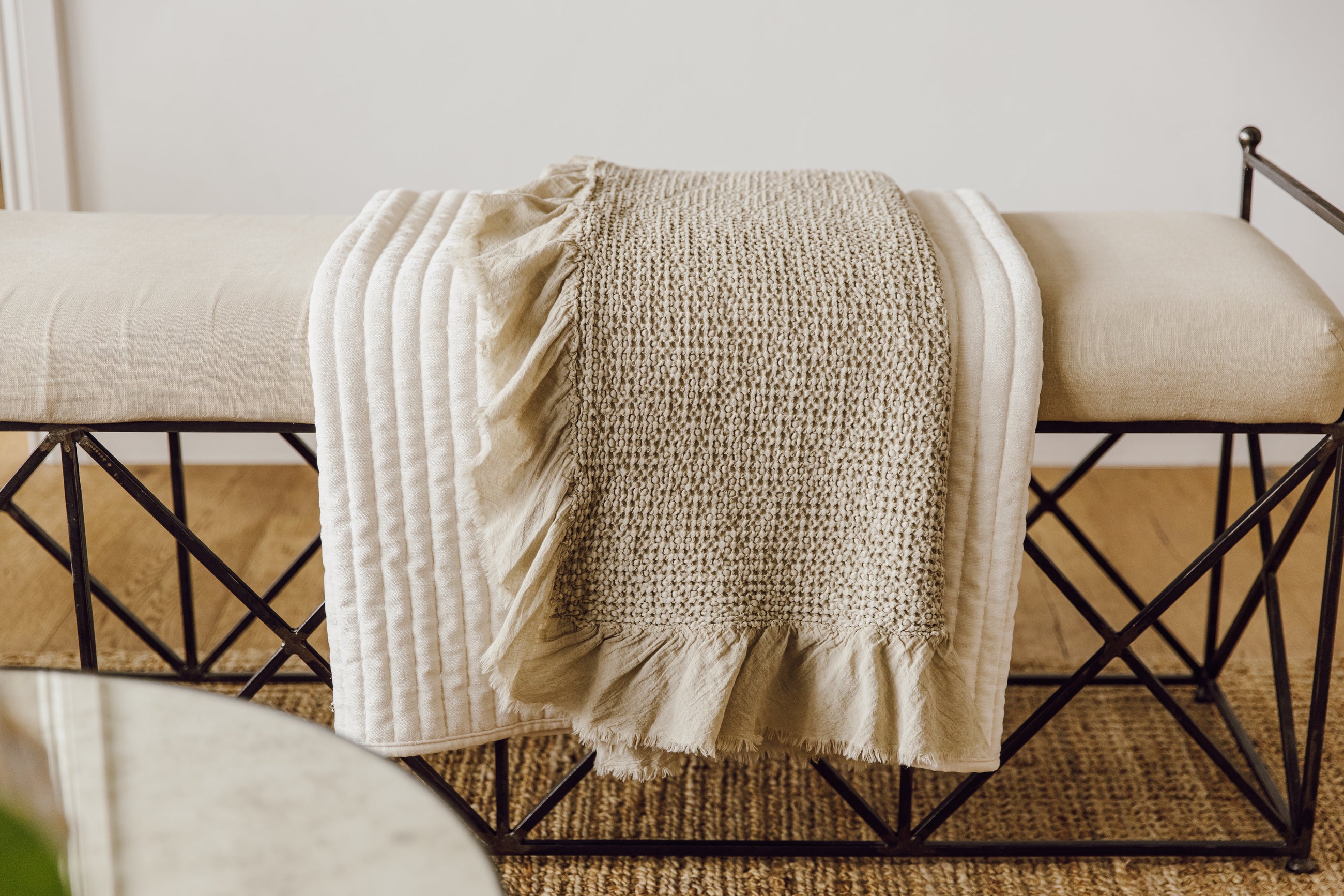 Cream and tan blanket on bench