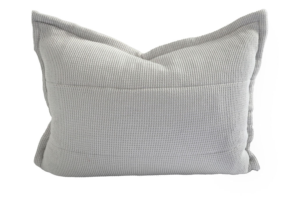 A gray textured pillow sham.