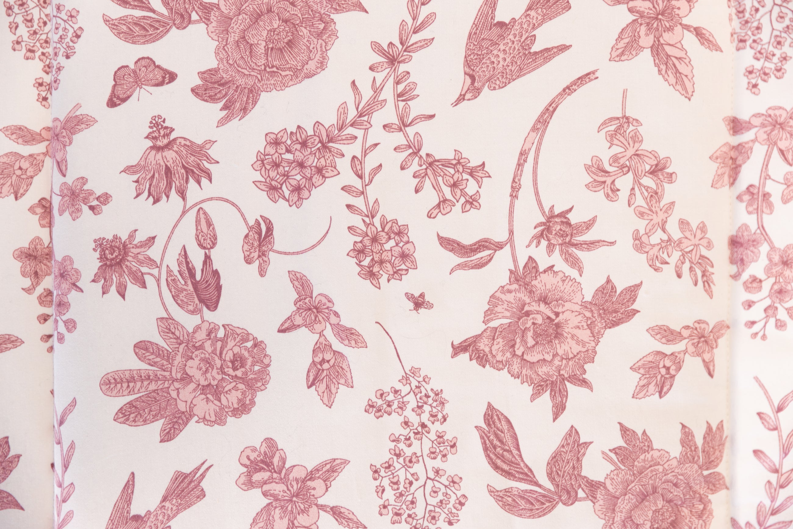 Pink and white floral pattern on blanket