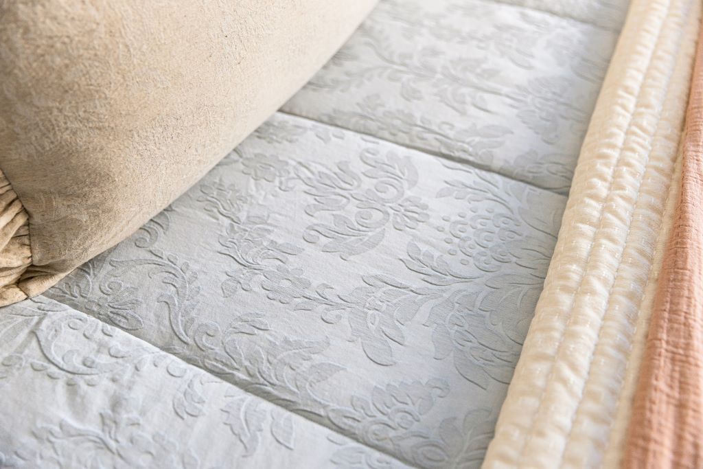 Close up photo of blue floral bedding