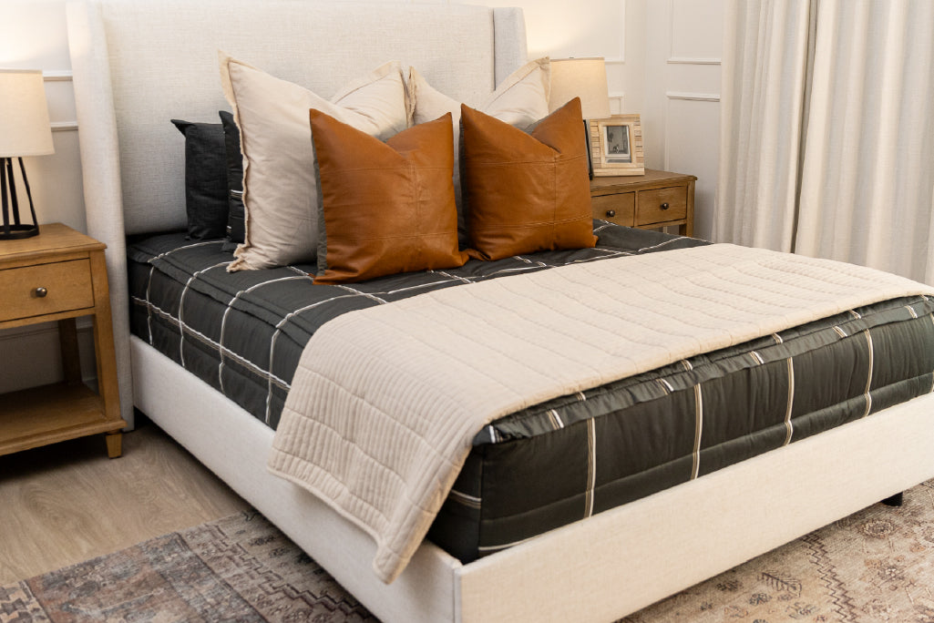 Charcoal plaid zipper bedding with tan, cream and rustic accessories.