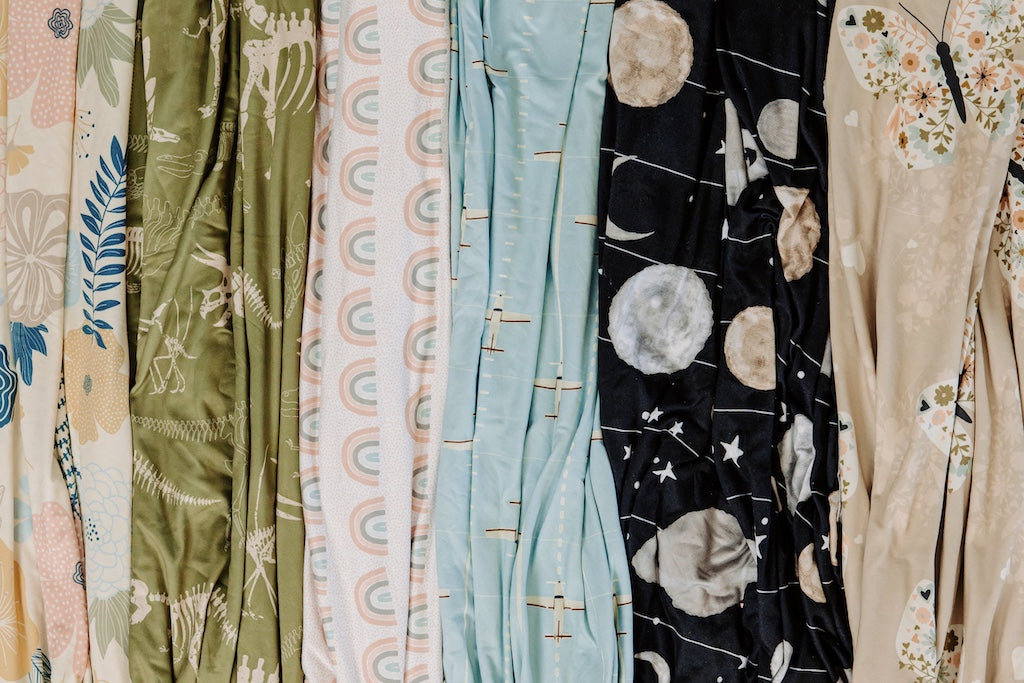 Up close photo of Flowers, Dinosaur, Rainbows, Airplanes and Outer space, and Butterflies Children blankets