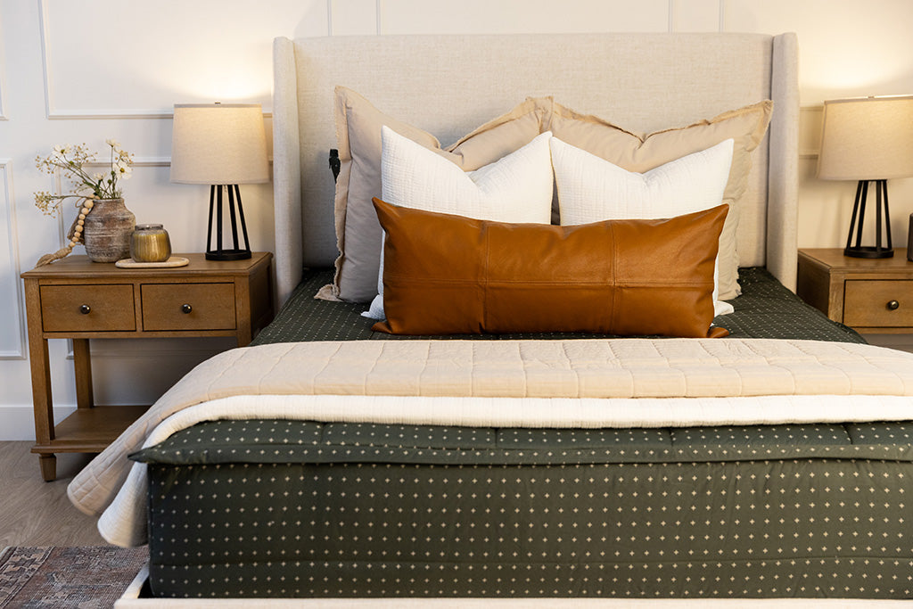 Green zipper bedding with white cream and tan accessories