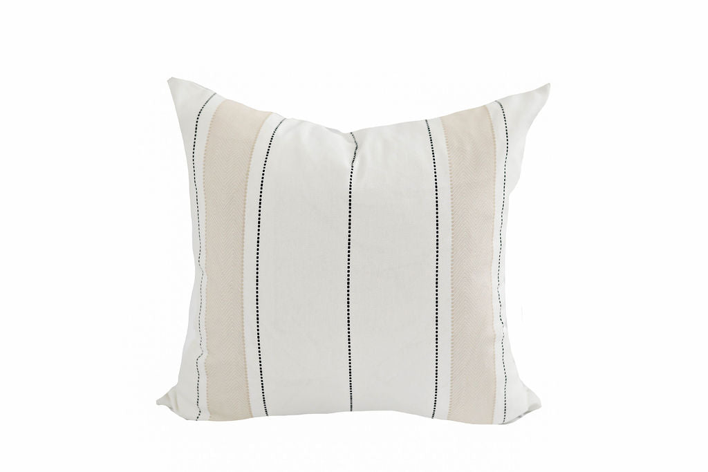 white pillow with tan and black stripes
