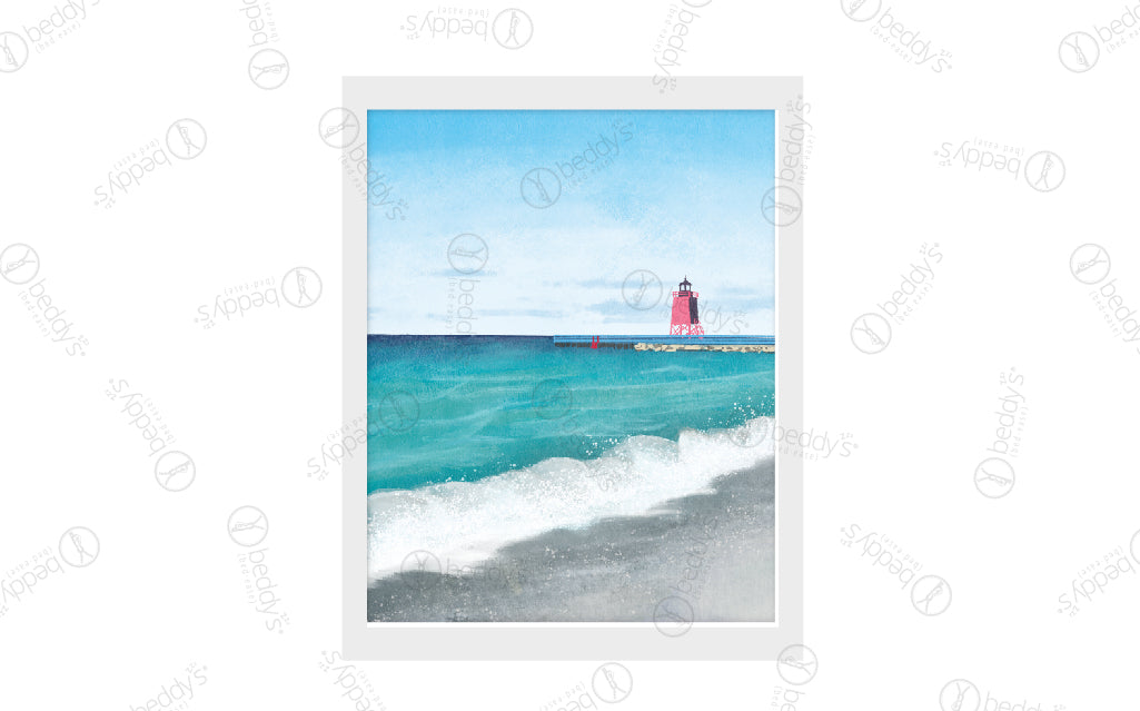 A painted beach with a lighthouse digital artwork showcased in a frame.