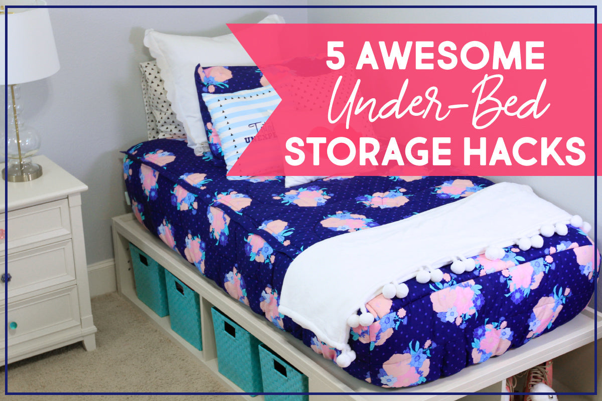 
      A bed made with floral zipper bedding situated on cube storage shelves with blue bins in each cube
    