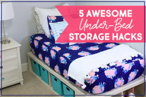 
      A bed made with floral zipper bedding situated on cube storage shelves with blue bins in each cube.
    