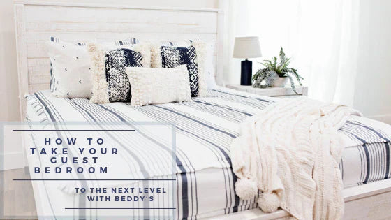 
      An infographic with a queen bed in a guest room made with striped zipper bedding and neutral bedding accessories.
    