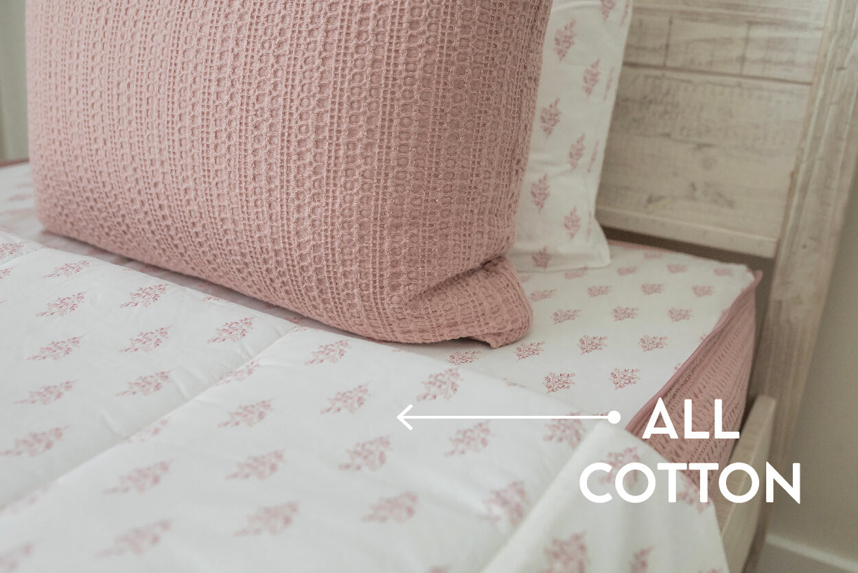 An infographic for all cotton lined beddy's, with the top of a pink zipper bedding set pulled back to show the all cotton lining inside.