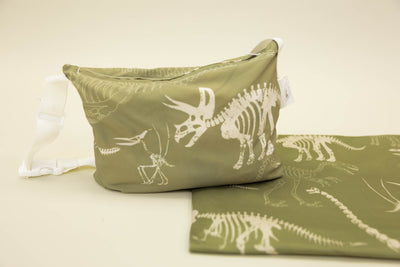 A child's dino print blanket and coordinating zipper pouch