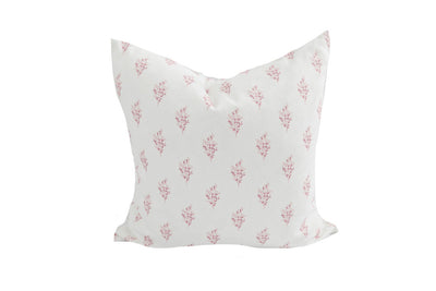 white pillow with pink floral design