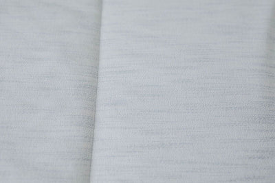 Close up of light blue zipper bedding