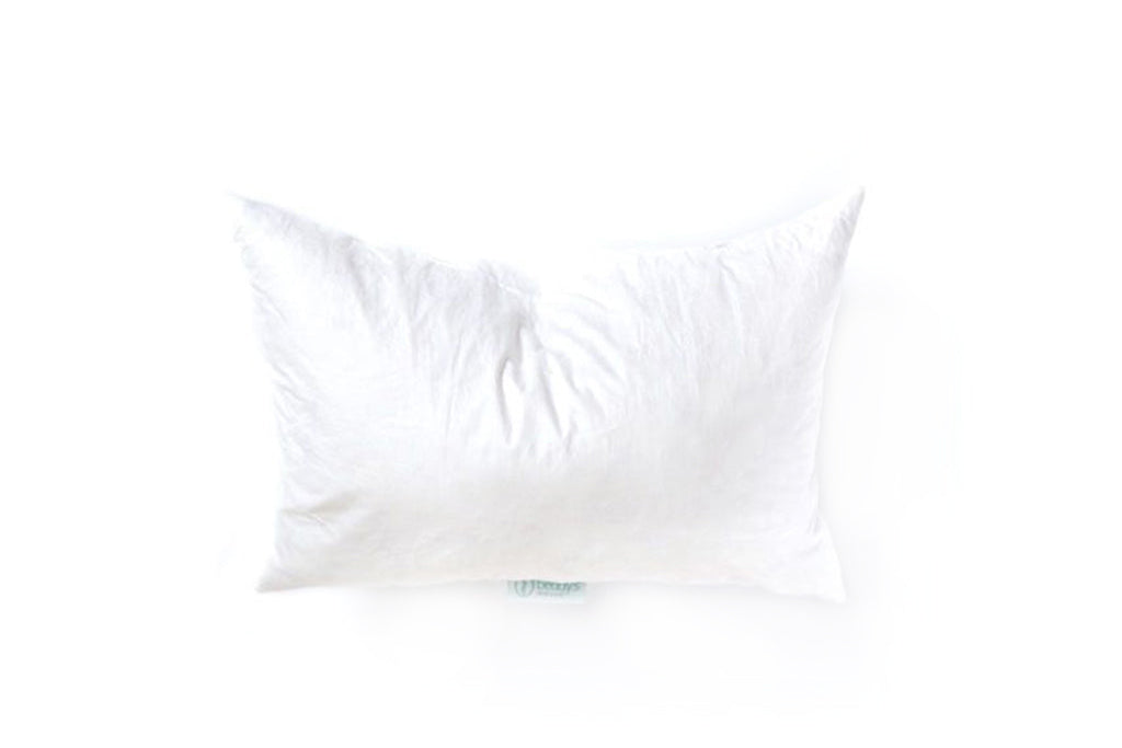 A white lumbar feather pillow insert. 