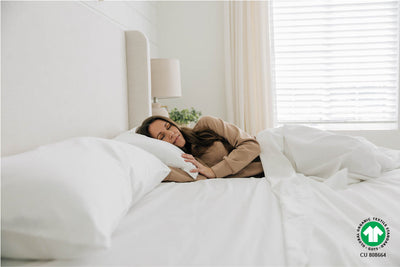 Woman sleeping in bed with organic  zipper sheets