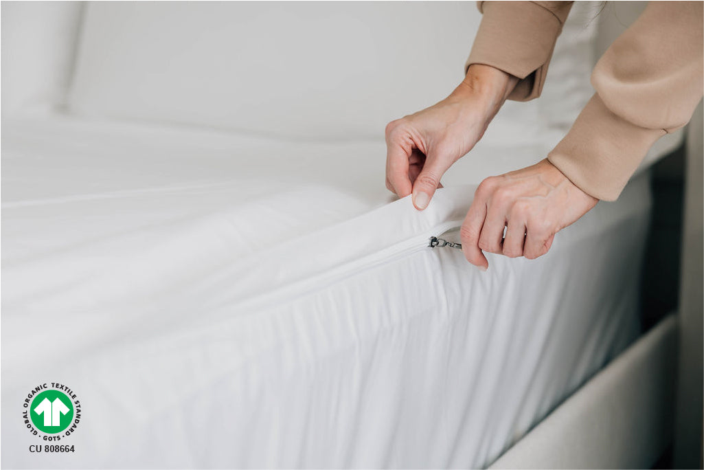 Woman zipping organic zipper sheets