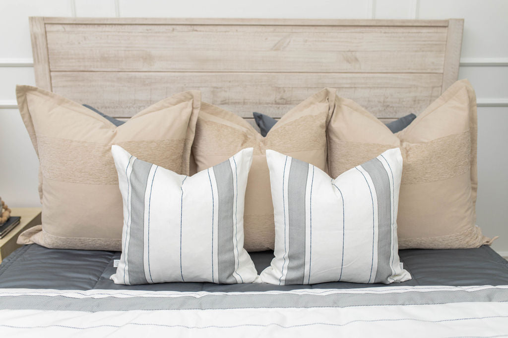 Gray zipper bedding with neutral pillows and blanket