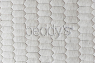 A close up of the Beddy's logo on a zipper mattress,