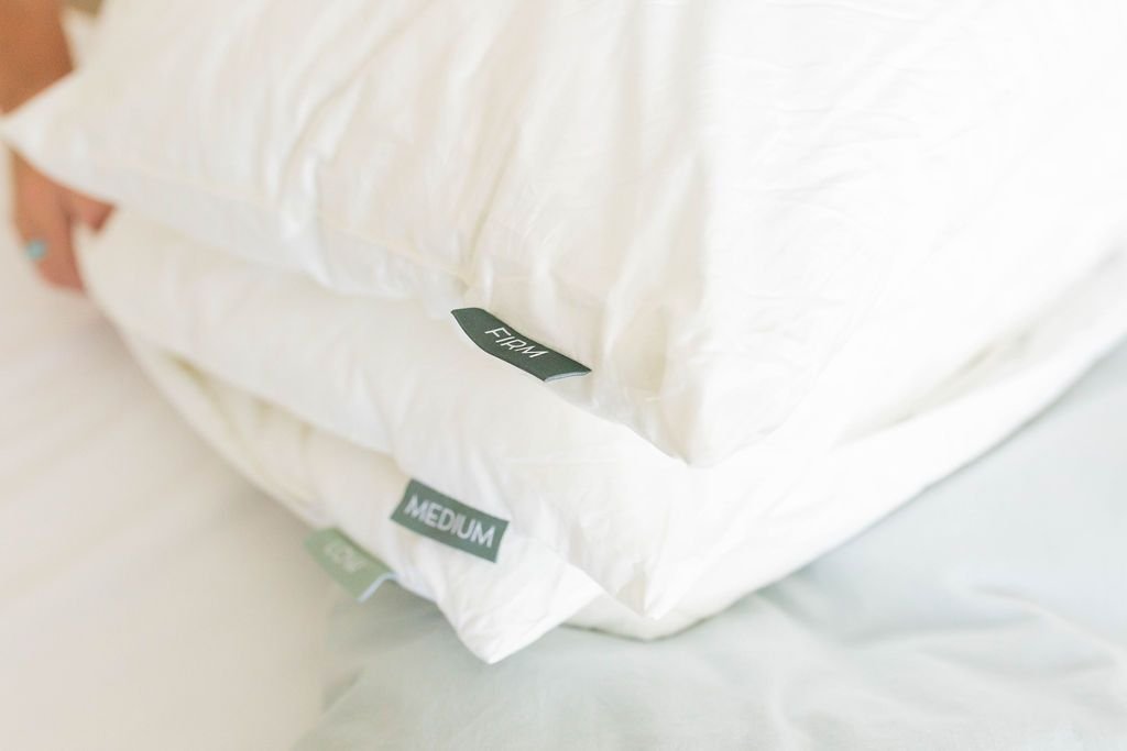 A close up of the firm, medium, and low pillow inserts for an adjustable pillow