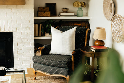 White textured pillow on chair in living room