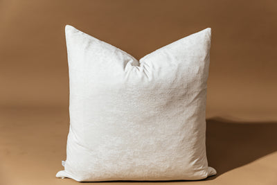 Backside minky white pillow on tan background