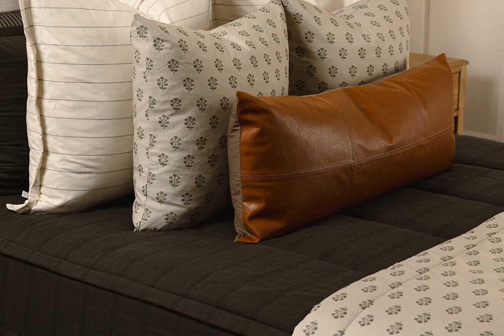 A close up photo of knit, black zipper bedding.