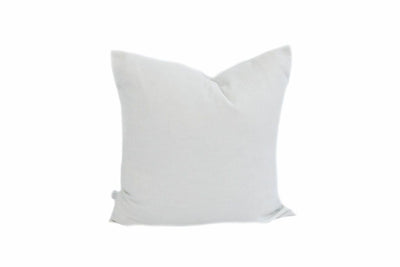 A light gray waffle textured pillow on a white background.