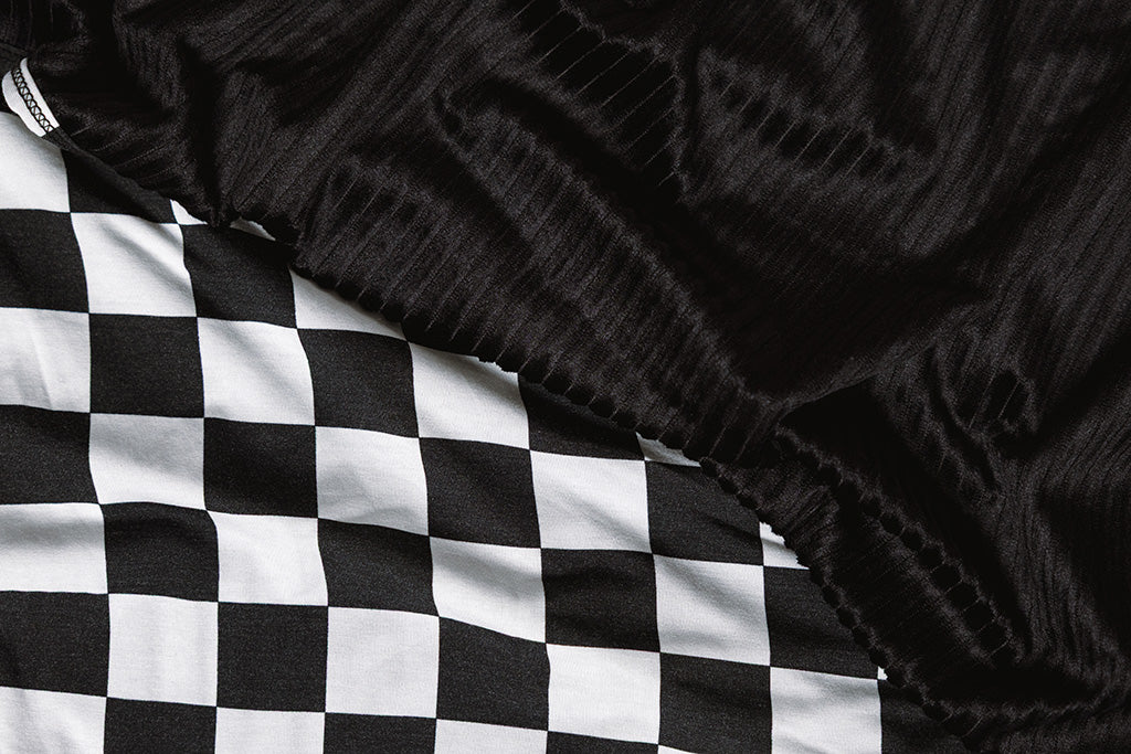 A black and white checkered blanket. 