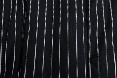 A close up view of the exterior of a black and white striped blanket
