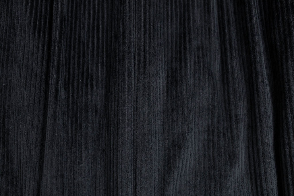 A close up view of a soft black minky interior of a blanket