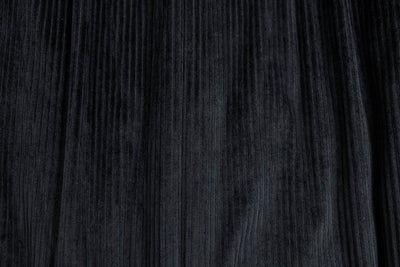 A close up view of a soft black minky interior of a blanket