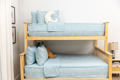 bedroom with bunk bed decorated with light blue zipper bedding and airplane design