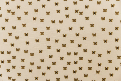 A close up of the interior of a set of butterfly zipper bedding, showcasing the small, neutral butterfly print.
