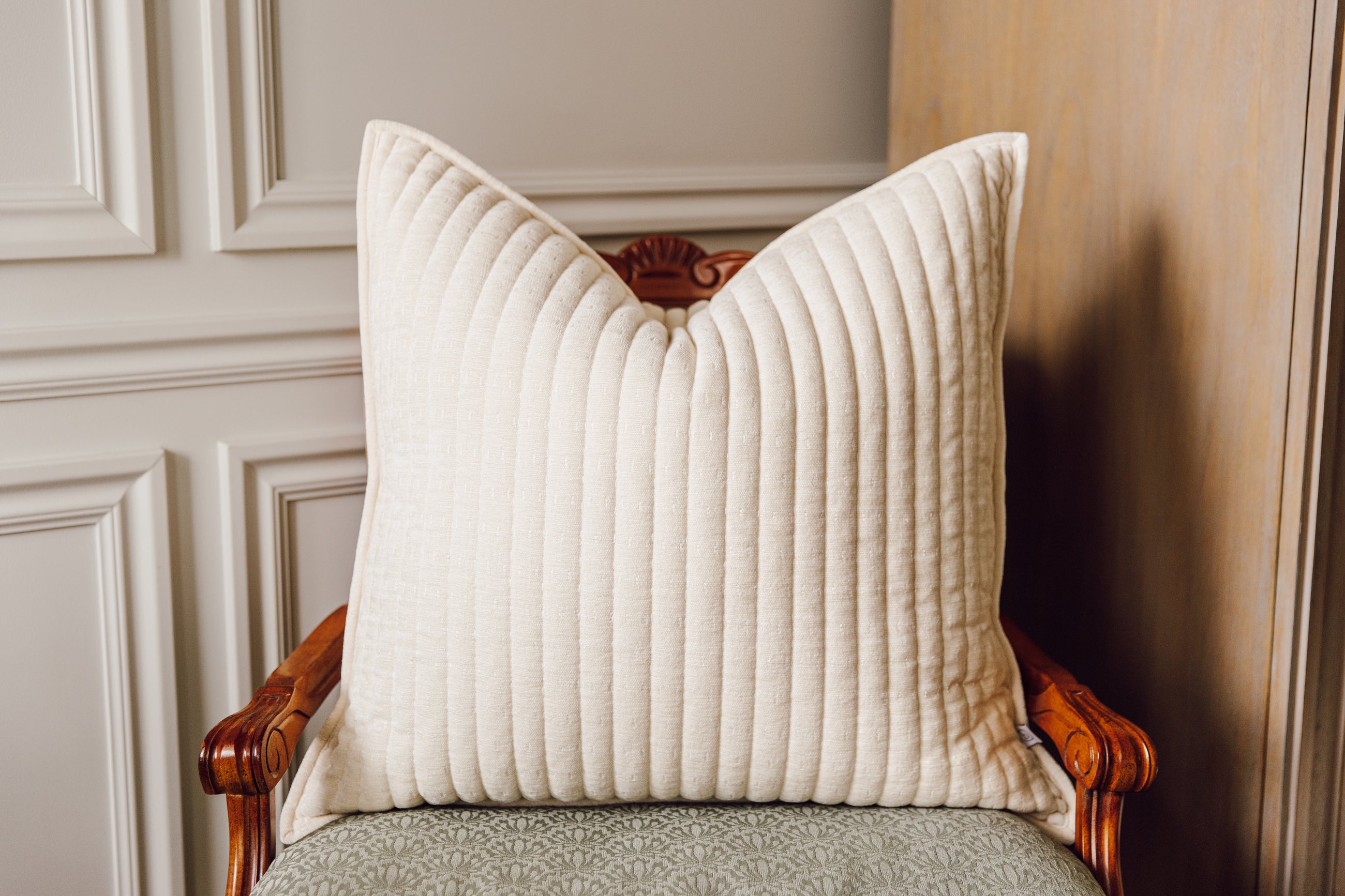 Cream textured Euro pillow on chair