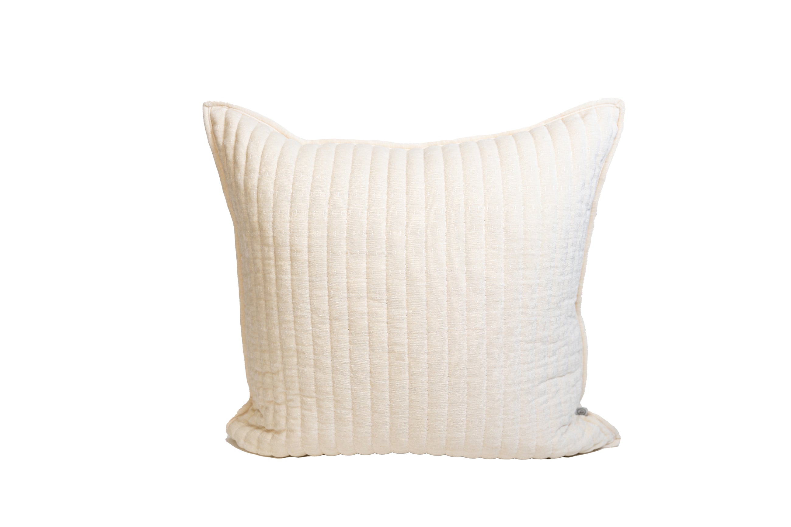 A cream textured pillow on a white background.