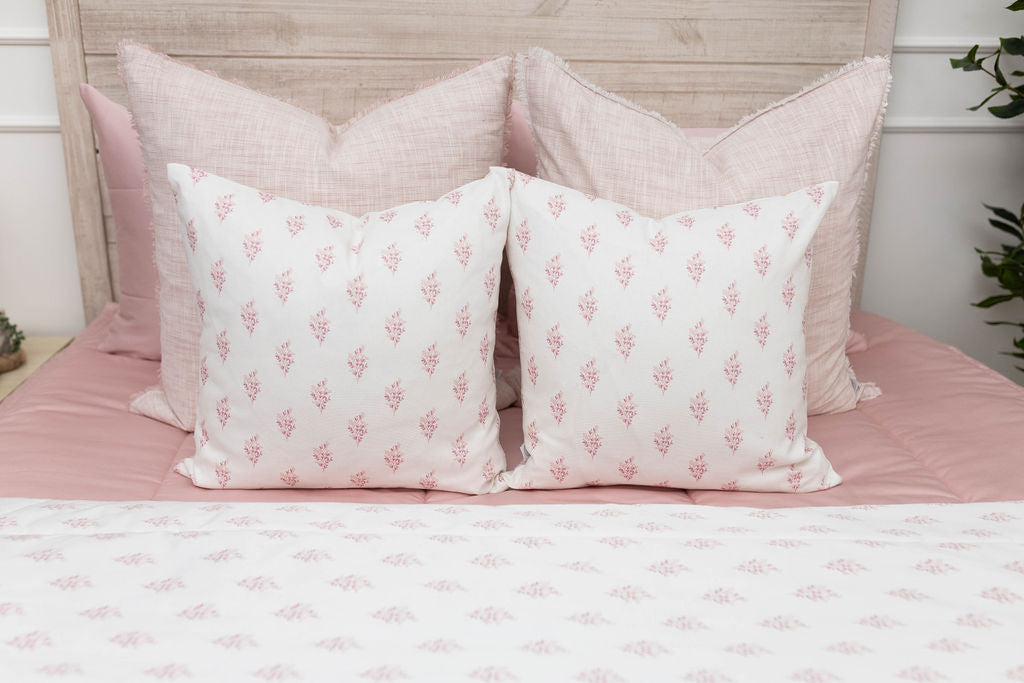 Pink zipper bedding bundle with coordinating floral pillows and floral blanket