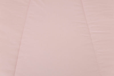 A close up detailed exterior view of a pink zipper bedding.