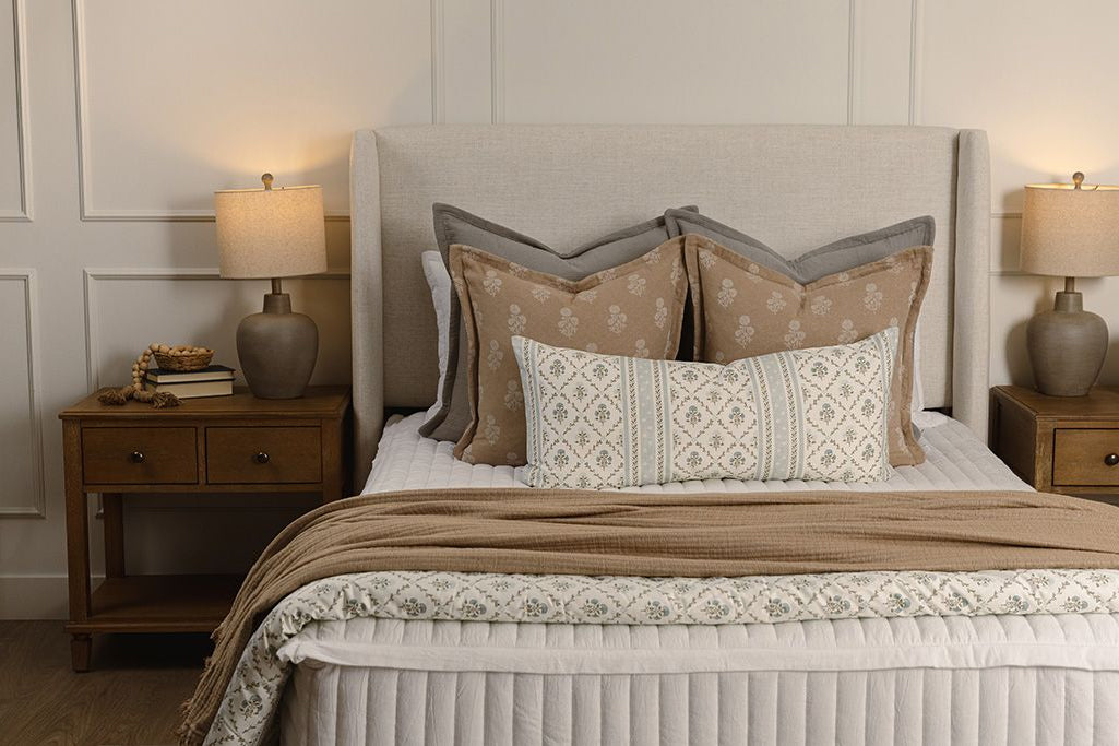 White stripe quilt zipper bedding with tan, gray, and floral accessories.