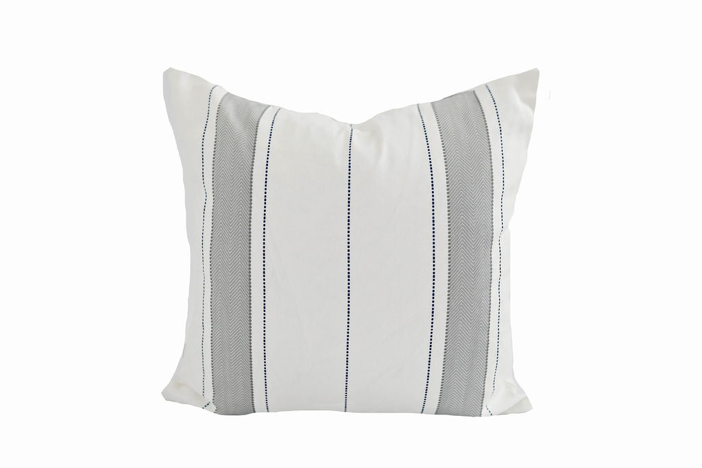 A white pillow with gray striping on a white background.