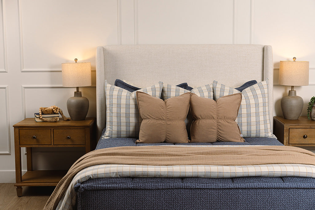 Soft, blue waffle texture zipper bedding with tan and plaid accessories.