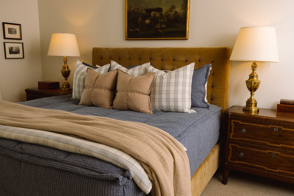 Soft, blue waffle texture zipper bedding with tan and plaid accessories.