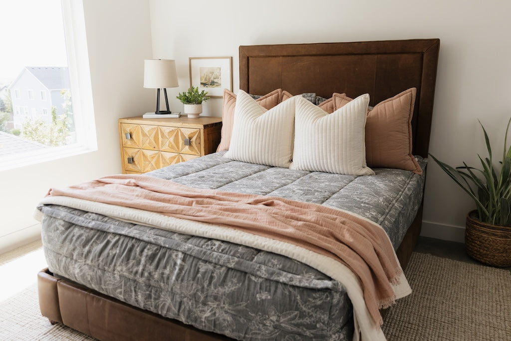 Sketched floral zipper bedding with cream and terracotta accessories.