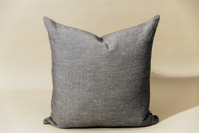 Gray euro pillow cover on cream background.