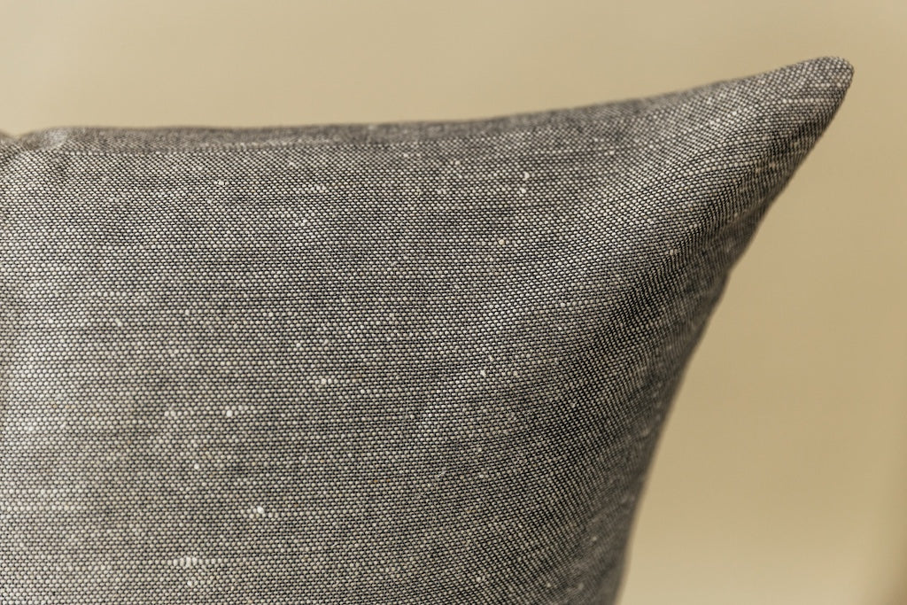 Gray euro pillow cover on cream background.