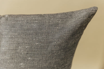 Gray euro pillow cover on cream background.
