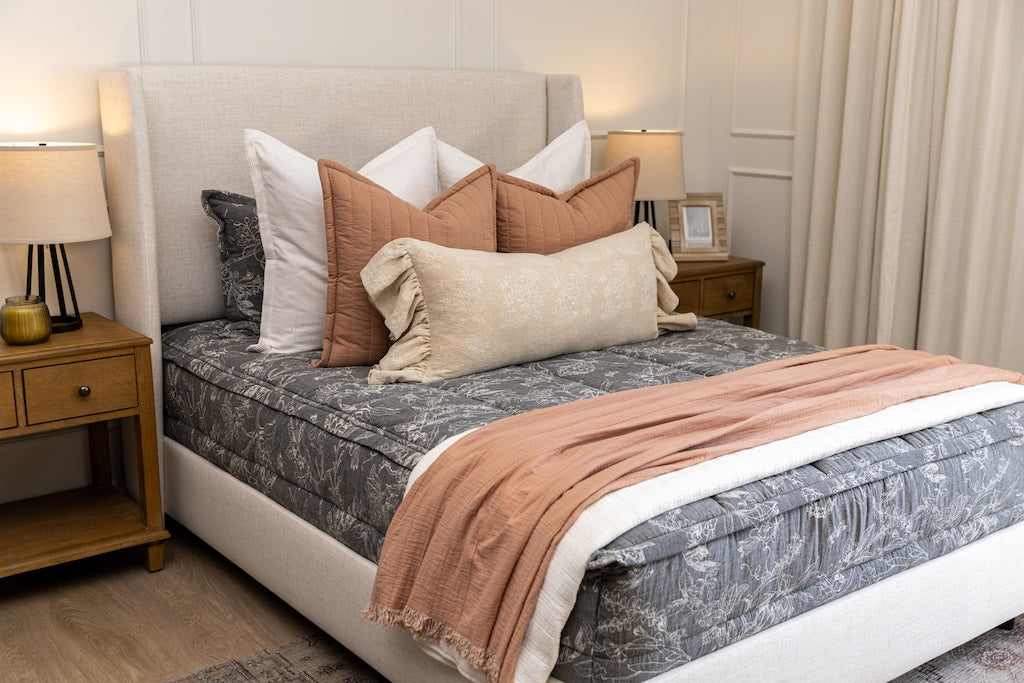 Sketched floral zipper bedding with cream and terracotta accessories.