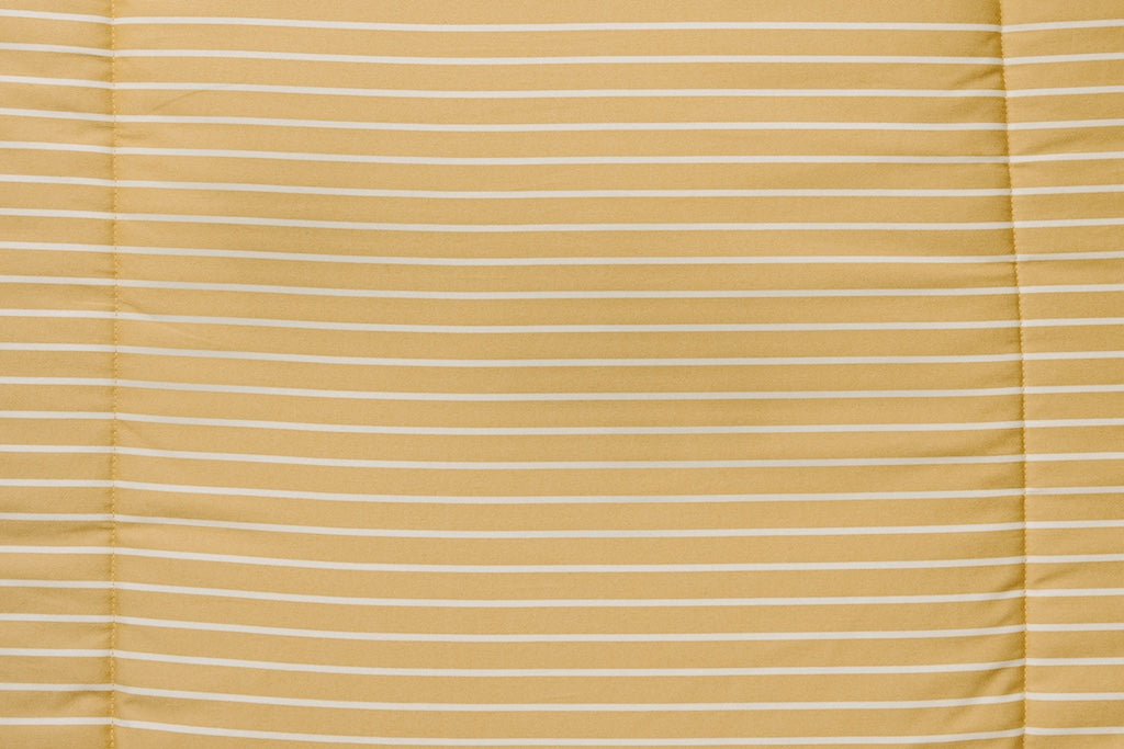 Yellow and cream stripe pattern on blanket.
