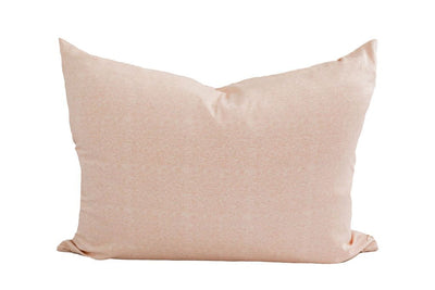 A peach pillowcase on a white background.