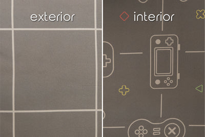 A close up of the exterior and interior fabrics of a set of gaming zipper bedding, showcasing the grid and game controller prints.