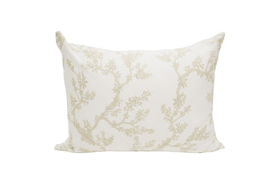 A white pillowcase with a tan design of treebranches